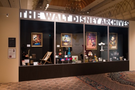 Reproduce a huge showcase in the lobby of Walt Disney Archives